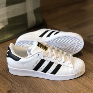 Adidas concha best sale blancos con negro